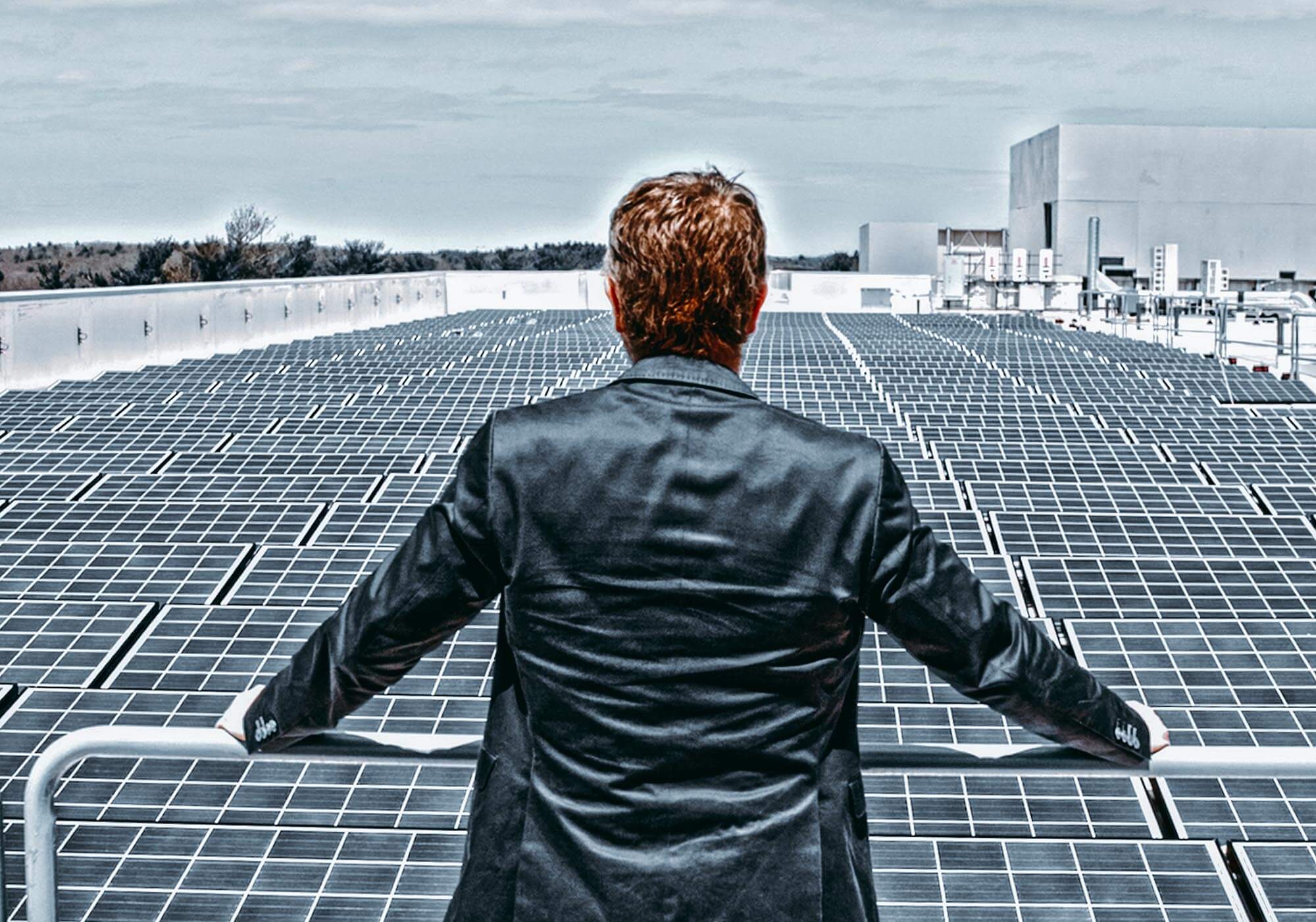 CEO Peter Bauer in front of Mimecast’s rooftop solar panels